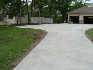 Concrete Driveway Leading Up to Garage