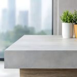 close up of concrete countertop with window and city view