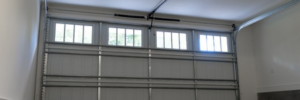 A concrete garage floor with a garage door in the background